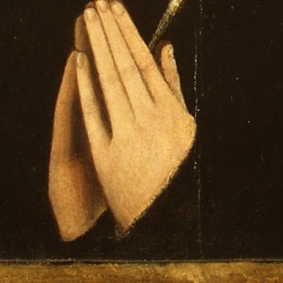 Look closely at his hands, clasped in thought or prayer.