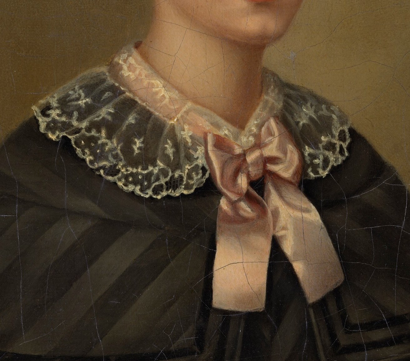 She wears a dark dress and a delicate lace collar.