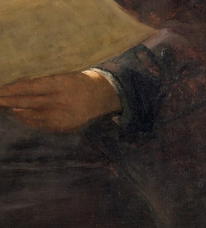 Hands that have painted thousands of animals , the grip is relaxed but purposeful, a detail a slow camera can dwell on to convey a life of labor.