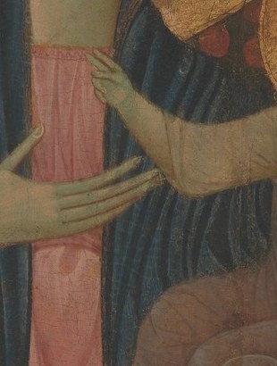 His hand is raised in blessing, three fingers extended.