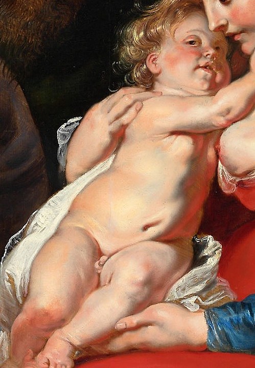 Mary cradles the infant Jesus.