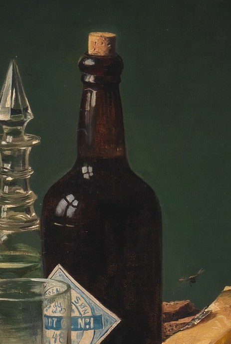 The bottle's shape and dark glass hint at a robust, possibly dark beer, adding to the rustic feel of the meal.